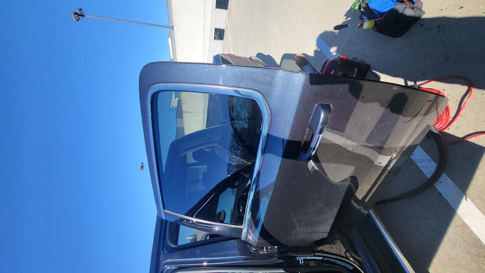 Car side door glass.